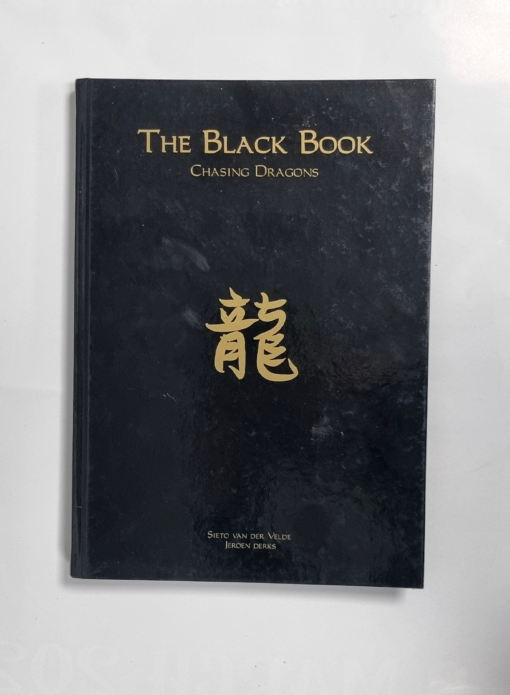 UTILISÉ - The Black Book - Chasing Dragons